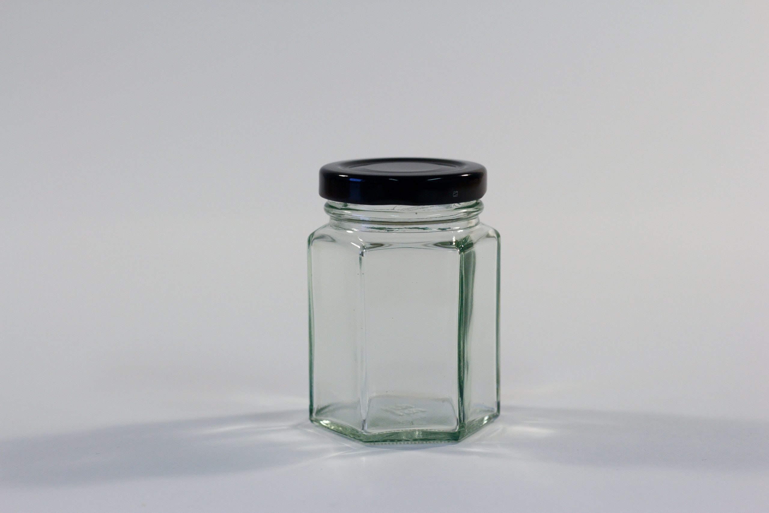 110ml Hexagonal glass jar with lid. Food grade packaging perfect for honey, jams, confectionarys and chutneys