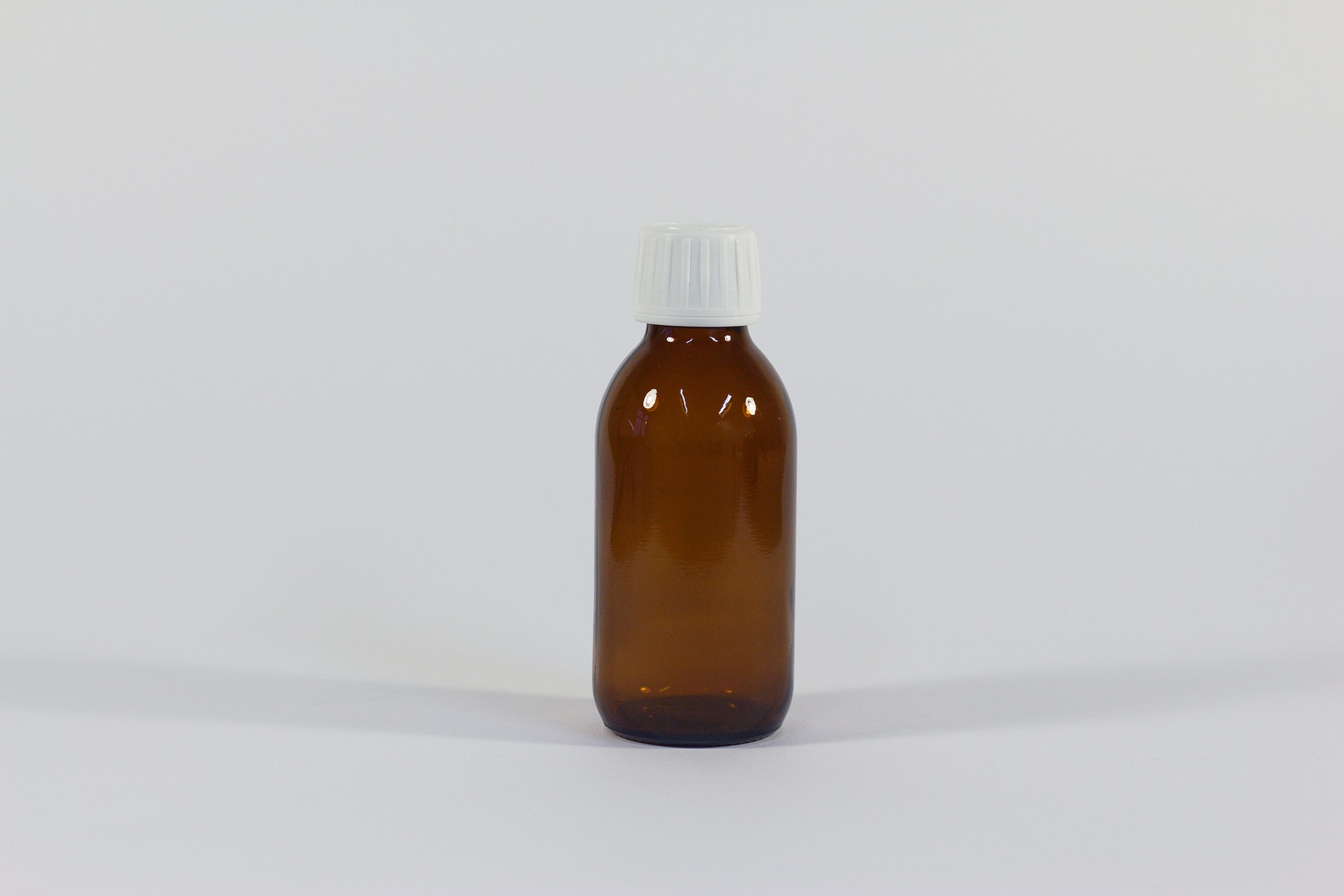 150ml amber glass bottle with white lid. From our glass packaging range.