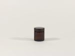 30ml amber glass jar with black lid. From our Glass packaging range.