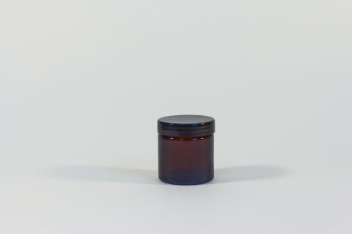 60ml amber glass jar with black lid. From our glass packaging range.