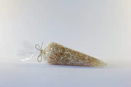 Cellophane Cone Bag WIth Wood Wool Inside On A White Background