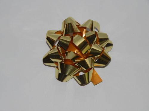 100mm Gold Metallic Stick On Bows on a White Back Drop.