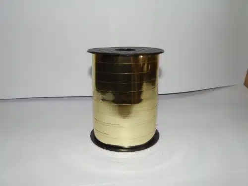 10mm gold curling ribbon on a white background. Perfect for seasonal packaging.