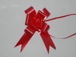 32mm red pull string ribbon on a white back drop.