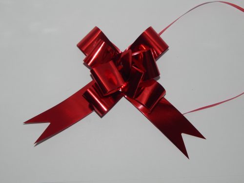 32mm Red pull string ribbon on a white back drop.